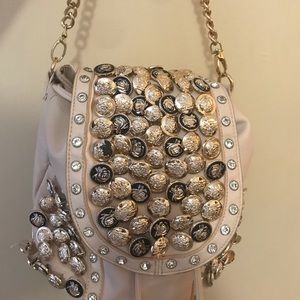 Bucket shoulder bag with buttons.
